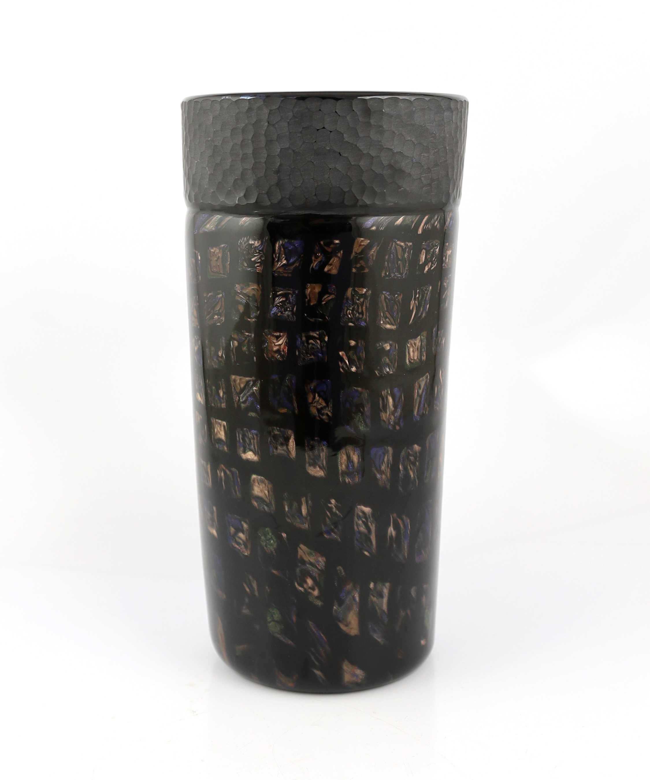 Vittorio Ferro (1932-2012) A tall Murano glass Murrine vase, with bronze squares on a black ground, beneath a battuto banded rim, unsigned, 34cm, Please note this lot attracts an additional import tax of 20% on the hamme